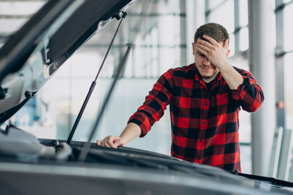 Henderson driver reviewing repair orders with a Henderson lemon law lawyer.